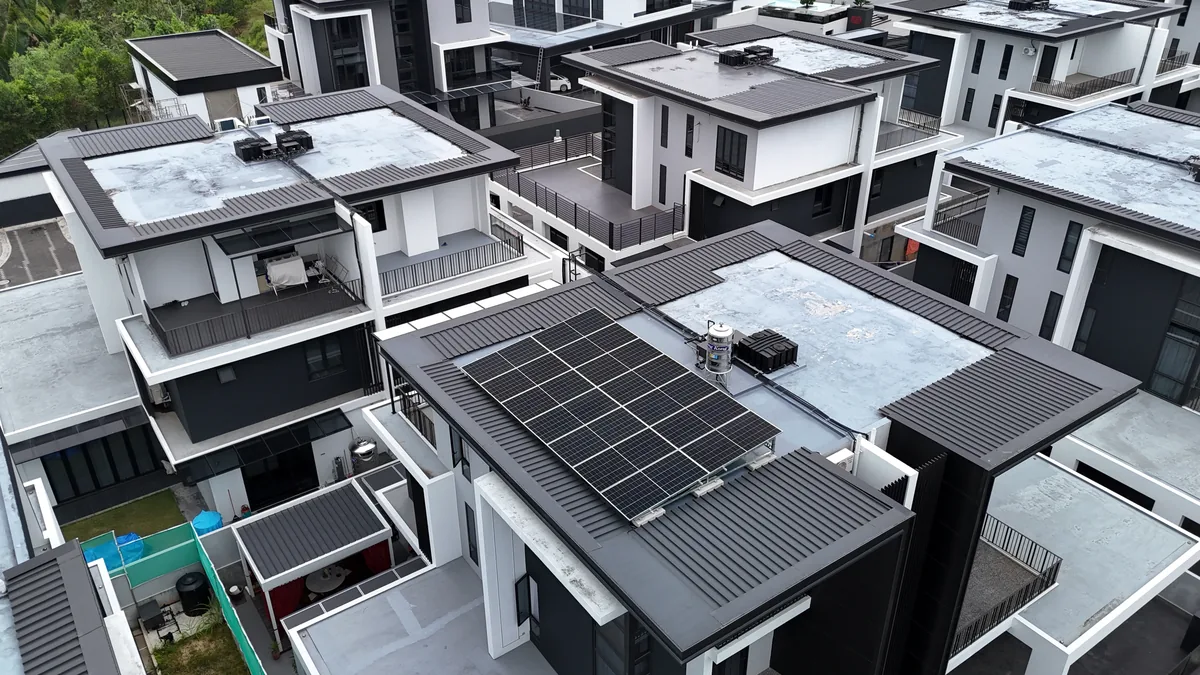 Modern tropical residential house with rooftop solar panels and battery storage in Kolombong, Kota Kinabalu