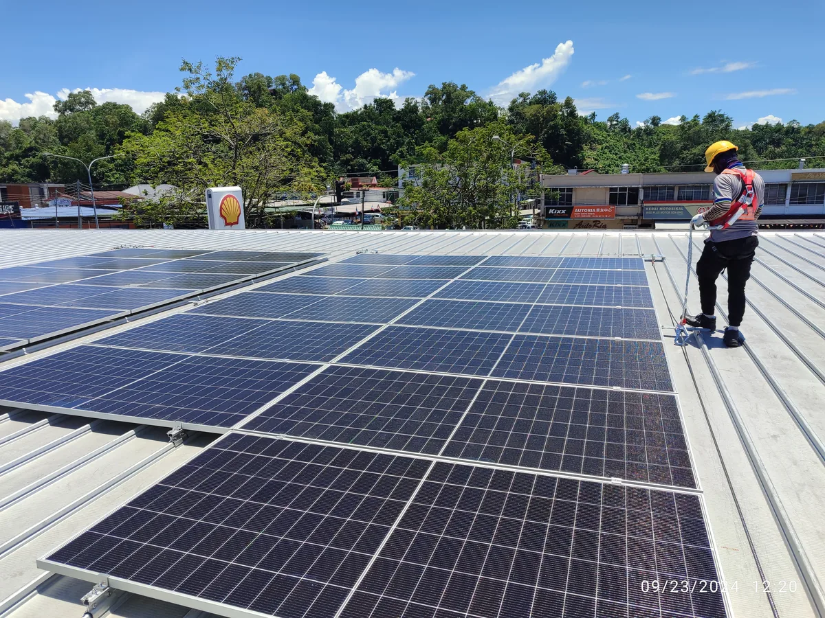 Fuel station canopy with solar panels in a Sabah town